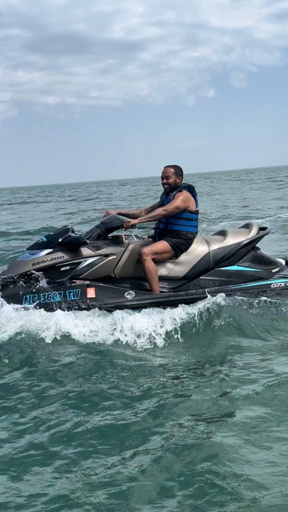 Josh smiling while riding a Sea-Doo on open water